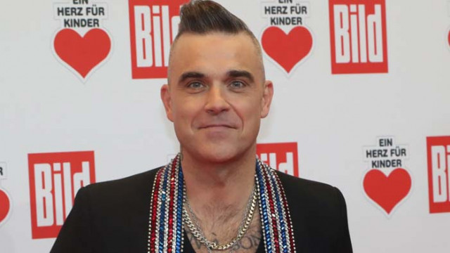 Роби Уилямс е пристрастен към голфа