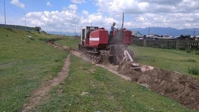 Изкопаха ров около сибирско село, пламнало с COVID-19